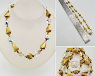 A beautiful gold tone bead and AB crystal bead necklace comprised of pear-shaped gold tone brushed metal beads interspersed with pear-shaped faceted AB crystals