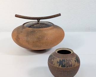 A modernist mica clay smoked fired vessel w/ bronze lid, signed Carol Green; and a southwestern pottery geometric pattern jar