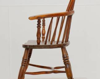 Antique handcrafted Windsor chair 18th C. The out swept arms formed from steam bent pieces of wood giving a lovely, curved shape; has a steam bent “concave crinoline” stretcher.