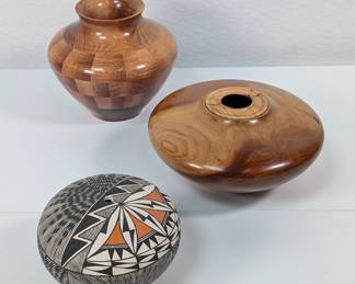 A polished segmented turned wood vase of cherry wood and spalted silver maple signed and numbered by artist C. Jameson, a burled turned wood vase signed by the artist, and a dazzling Acoma Pueblo pottery seed pot signed by Native American artist Darin Victorino,