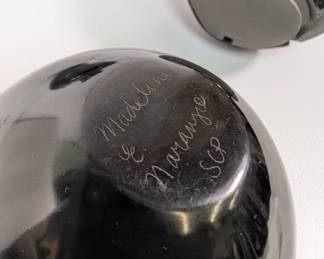 Closeup of the Santa Clara Pueblo black vase signed by Madeline Naranjo