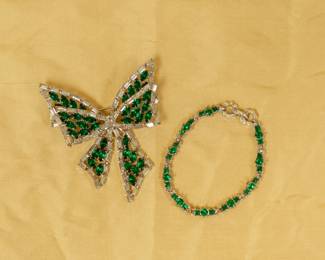 A vintage Vendome green and clear rhinestone ribbon bow brooch, and a vintage green and clear rhinestone bracelet