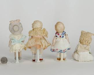 Reverse view of the antique small bisque porcelain dolls