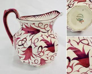 A vintage Wedgwood of Etruria and Barlaston cream color pitcher with plum color leaves and vines