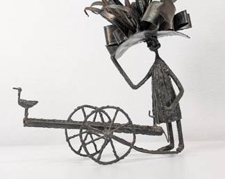 Figural metal sculpture by Simon Kops. The sculpture by Simon Kops is signed Kops on the back of the figure's hat.
