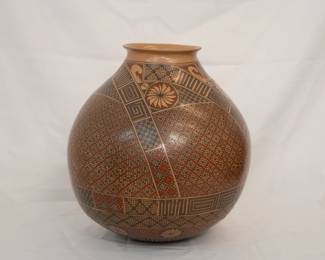 A very large and beautifully painted Mata Ortiz Pueblo art pottery vase, crafted and signed by artist Miguel Bugarini. This olla or traditional form of vessel, is patterned with finely painted geometric designs, and is 15 inches high.