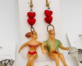Incredible vintage dangle earrings with a pair of beach going figurines!