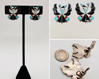 A pair of classic Zuni thunderbird design clip earrings with jet, turquoise, mother of pearl, and coral set in silver, signed B. Wallace.