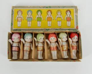 A vintage set of bisque porcelain dolls in original box, made in Japan