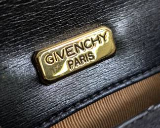 Closeup of Givenchy Paris vintage black satin embroidered shoulder bag