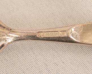 Closeup of the set of Christofle France silver plated teaspoons and table spoons