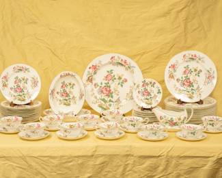 A beautiful set of vintage Wedgwood bone china Charnwood pattern porcelain dishware including sauce boat, cups and saucers, dinner plates, salad plates, serving platter and more, all with lovely colorful floral decoration