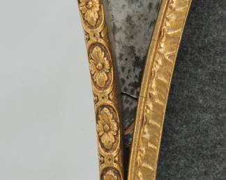 Closeup of the vintage French Rococo Decorative Gold Oval Wall Mirror