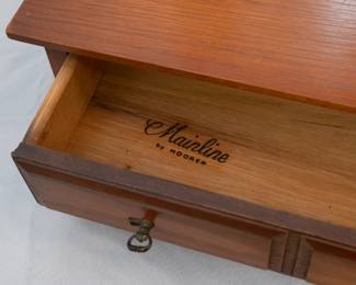 Closeup of the attractive mid century Mainline by Hooker Furniture dresser top shaving / jewelry mirror with two drawers in base