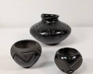A striking matte on black painted design hand coiled pottery olla signed Jeronimo Villalpando from Mata Ortiz in Chihuahua Mexico; a Santa Clara Pueblo black pottery bowl signed by Madeline Naranjo and Adrian Garcia, and a Santa Clara Pueblo black vase signed by Madeline Naranjo