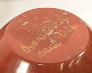 Closeup of the carved pottery jar signed by Southwest Native American artist in Santa Clara Pueblo