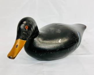 Closeup of the vintage hand carved and painted wooden duck decoy