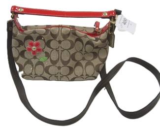 COACH SIGNATURE COLLECTION WITH SMALL LEATHER FLOWER ON FRONT.  as is