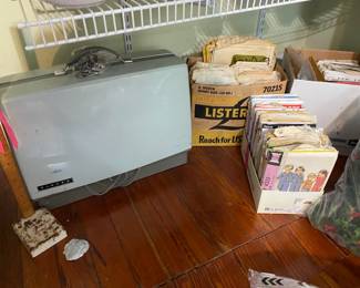 Singer sewing machine and vintage patterns.