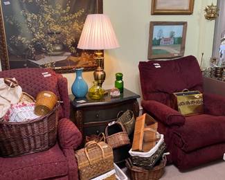 Two well-loved recliners, baskets galore and nice artwork.  Two house scenes were painted by Doris Clemens.