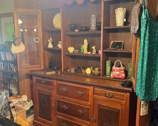 A beautiful buffet with lots of treasures displayed above! Check out the glass purse on the right, lower shelf! The shiny dress and antique purses are described in another photo! 