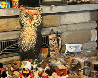 Vintage Halloween decoration featuring a winking owl, likely a die-cut made from cardboard or similar material. The photo at the top is in an antique metal frame. 
