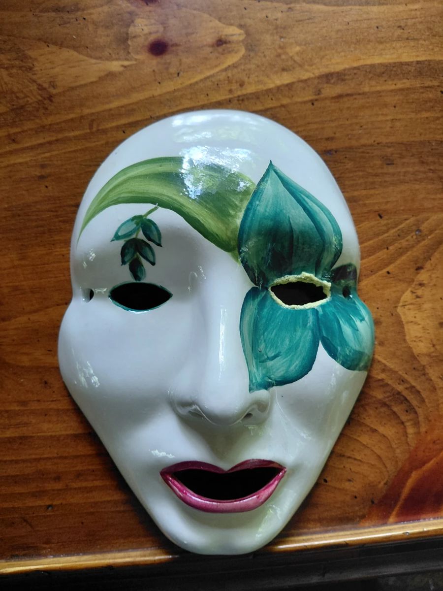 China mask that hangs on wall.
