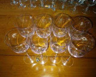 Set of 8 pink tinged tall wine glasses.