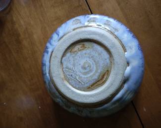 Bottom of lighter blue bowl.
