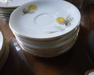 Yellow rose china set. 9 cups, 8 saucers, 6 medium plates, 6 small plates, 2 dinner plates, 1 sugar bowl, 3 soup bowls, 1 serving platter, 2 serving bowls.