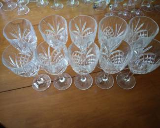 Upper view of (10) tall crystal wine glasses.
