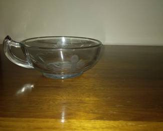 Flower etched crystal candle votive.