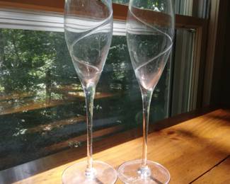 Pair of swirl designed champagne glasses.