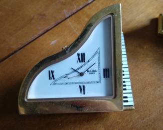 Clock of piano shaped.