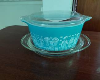 Colorful designed serving bowl with glass lid.