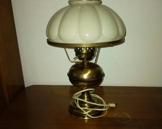 Cream colored glass shade lamp.