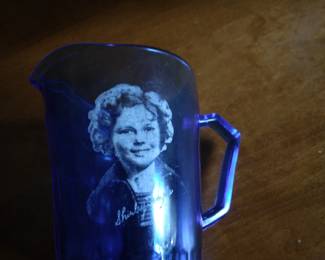 Shirley temple decorated small blue pitcher.