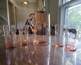 Flower drink set in pink. Has 1 jug, and 4 cups.