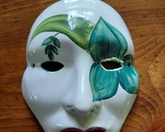 China mask that hangs on wall.
