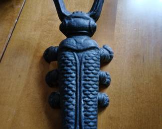 Cast iron bug shelf decor.