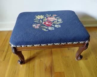 Small footstool. Blue woven pattern with flowers.                       16 inch long, 11.5 inch wide, 8 inch tall.