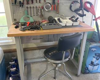 Tool bench with chair and pegboard