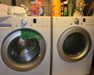 LG front loading washer & dryer - with stands