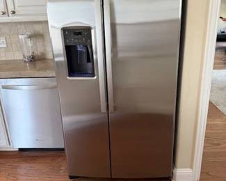 GE stainless refridgerator/ freezer with water and ice in the door