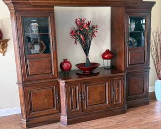 Entertainment center with art pieces and the glass globe on top