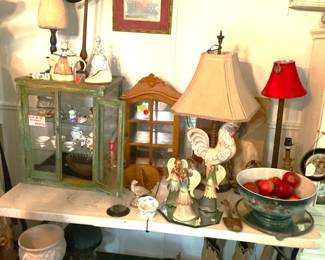 Lamps, curio cabinets and more roosters.