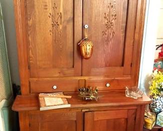 Oak pie safe with wood panel doors.
