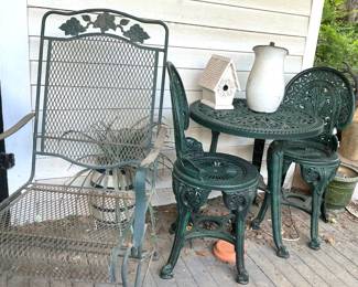 One of two  vintage green wrought iron arm chairs, Ironstone pitcher, ceramic bird house and 3 piece bistro set.