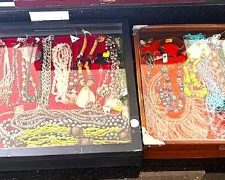 Seven cases of vintage jewelry.  Larger cases are also for sale.
