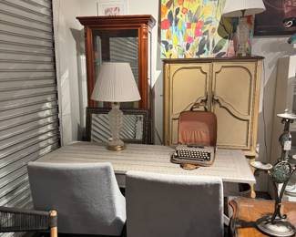 dining table and chairs, lamps, and curios/armoires